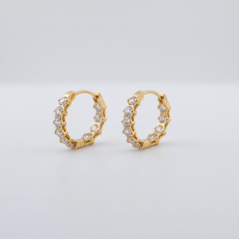 Pair of silver hoop earrings on a light gray background