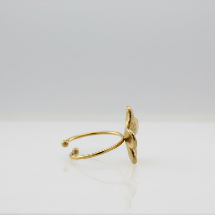 Gold earring in a gray box