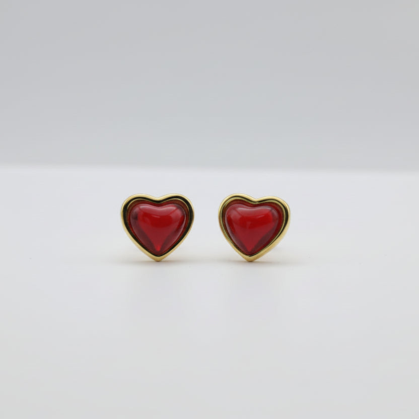 Heart-shaped object with gold border on a white background