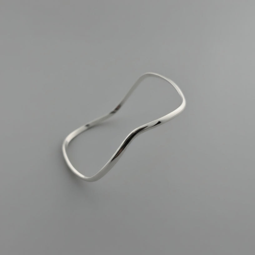 Silver Bracelet on a light gray background