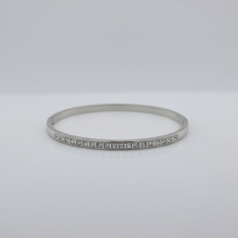 Silver Bracelet with small Cubic Zirconia stones on a white background