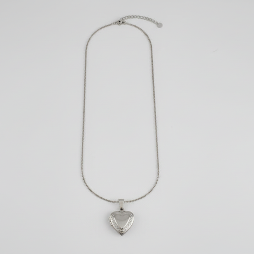 Necklace with a heart-shaped pendant on a light gray background