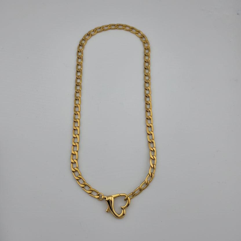 Gold chain on a gray background