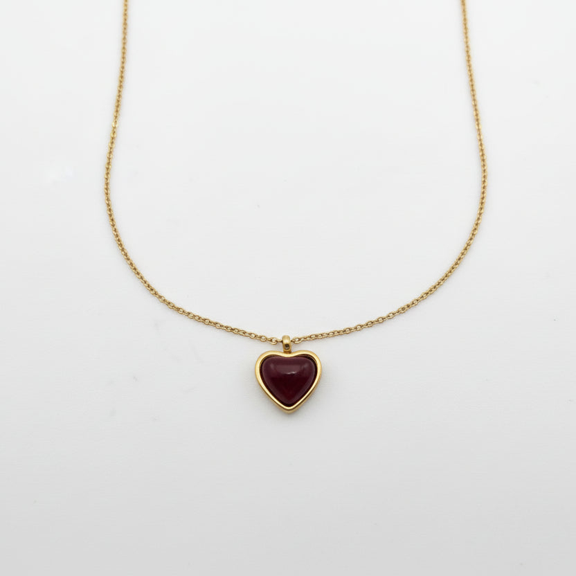 Necklace with a heart-shaped pendant on a light gray background