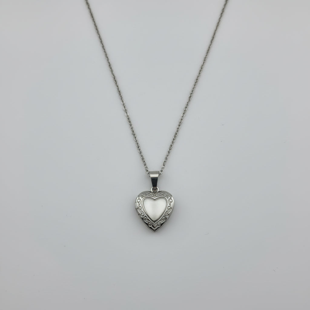 Heart-shaped pendant necklace on a gray background