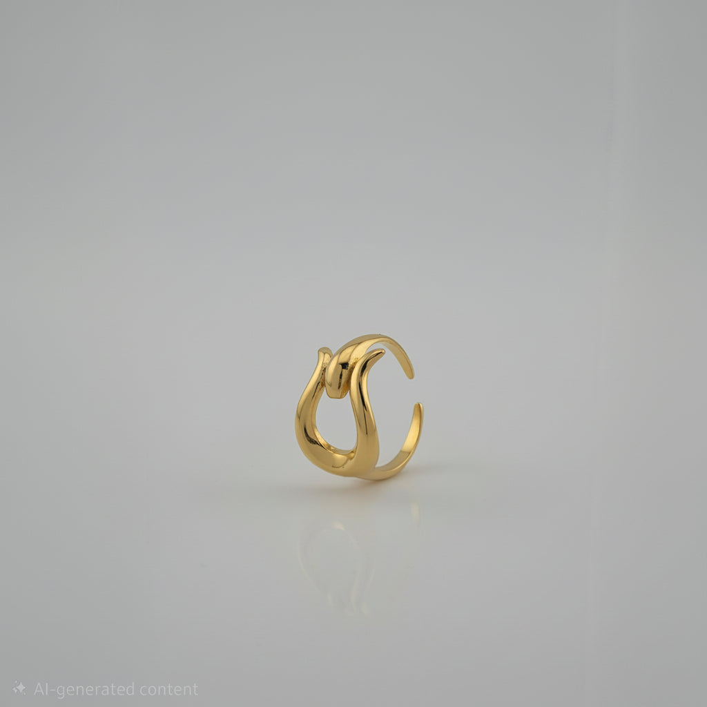 Gold earring on a light gray background