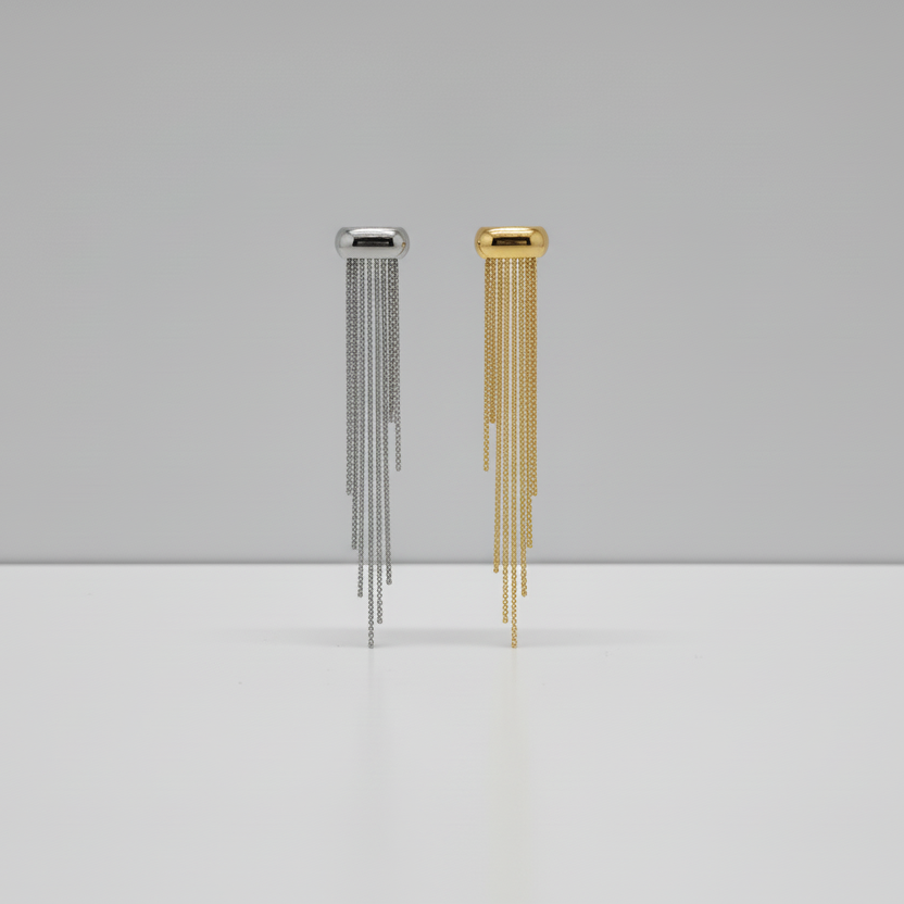 Gold wall-mounted chime on a gray wall