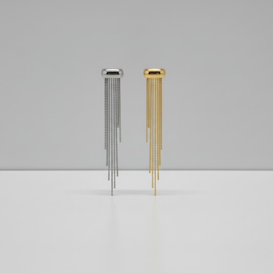 Gold wall-mounted chime on a gray wall